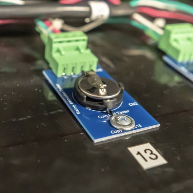 Coin cell battery tester